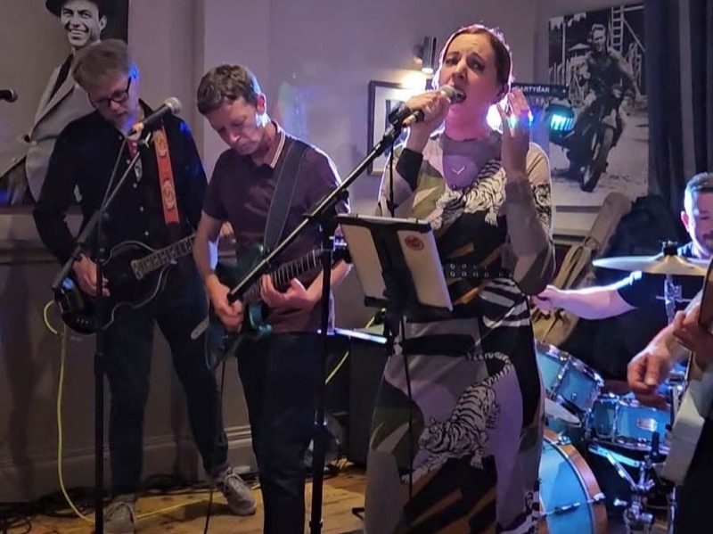 The Vests party band playing to a crowded room at The Hassocks pub in Hassocks, West Sussex